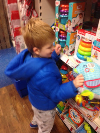 Zac choosing a new sensory toy