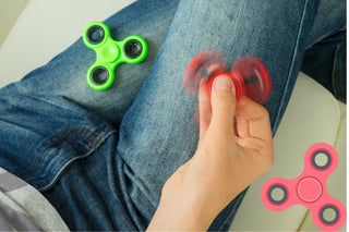 Adult using a fidget toy to improve focus and reduce stress