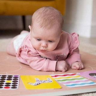 Baby exploring sensory toys designed to support early sensory development