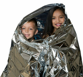 Children exploring a sensory foil blanket for tactile and visual sensory play