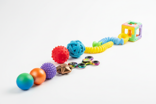 Fidget and sensory toys lined up to encourage different types of play for children with autism and ADHD